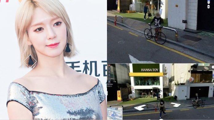 Bên ngoài Burger King, thành viên Choa (cựu trưởng nhóm AOA) đang tạo dáng chụp ảnh bên cạnh xe đạp. (Nguồn: Internet)