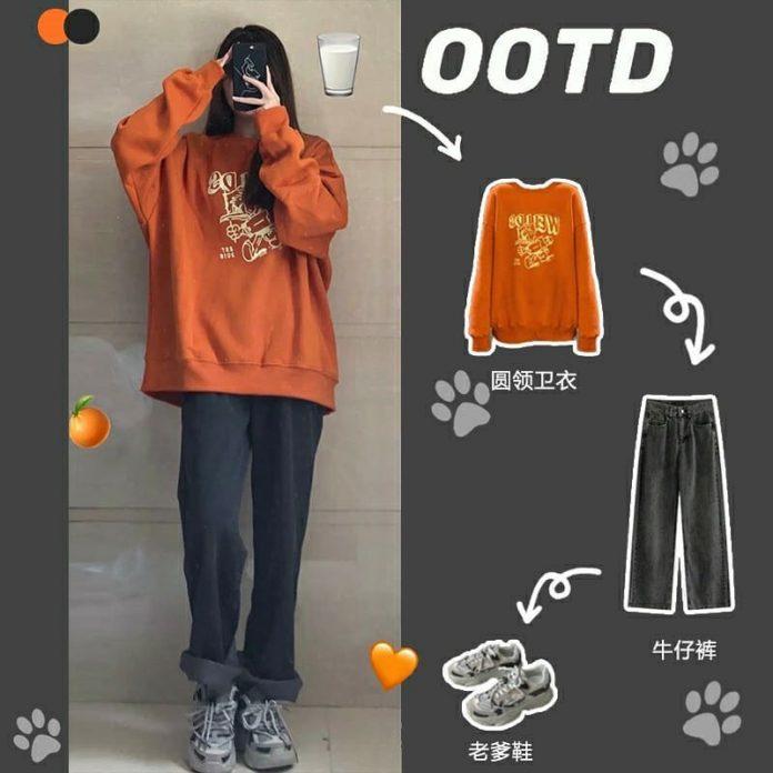 Quần ống rộng sắn gấu phối áo sweater cam (Nguồn: Internet) Quần ống rộng sắn gấu phối áo sweater cam (Nguồn: Internet)