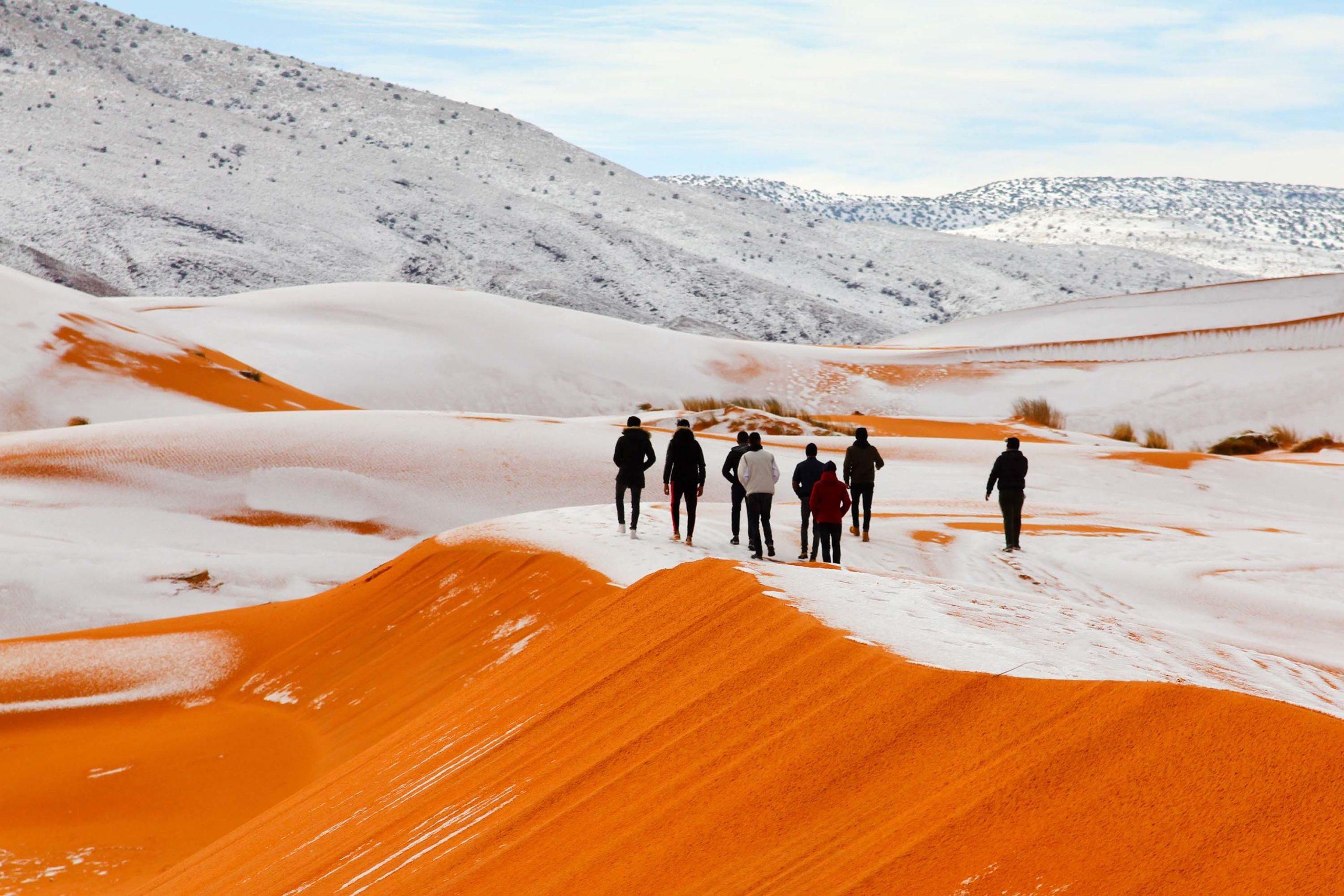 Mandatory Credit: Photo by Geoff Robinson Photography/REX/Shutterstock (9309883af) Snow in the Sahara Desert near the town of Ain Sefra, Algeria Snow in the Sahara Desert - 07 Jan 2018 *Full story: https://www.rexfeatures.com/nanolink/tvw5 As much of the northern hemisphere sees record cold temperatures, the SAHARA Desert has been hit by SNOW for the second time in four decades. Photographers have taken incredible pictures of 40cm deep snow covering the sand in the small Saharan desert town of Ain Sefra after a freak winter storm yesterday (Sun). The town in the world's HOTTEST desert had not seen snow for 37 years when it arrived this time last year and locals were stunned when it began falling on the red sand dunes yesterday morning. Snow started falling in the early hours of Sunday morning and it quickly began settling on the sand. Photographer Karim Bouchetata said: "We were really surprised when we woke up to see snow again. It stayed all day on Sunday and began melting at around 5pm."