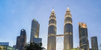 KUALA LUMPUR, MALAYSIA - Aug 21, 2015: Petronas Towers. Petronas Towers, also known as Menara Petronas is the tallest buildings in the world from 1998 to 2004.; Shutterstock ID 315627185; Departmental Cost Code : 162800; Project Code: GBLMKT; PO Number: GBLMKT