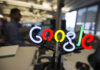 A neon Google logo is seen as employees work at the new Google office in Toronto, November 13, 2012. REUTERS/Mark Blinch (CANADA - Tags: SCIENCE TECHNOLOGY BUSINESS LOGO) - GM1E8BE056L01