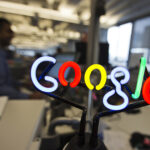 A neon Google logo is seen as employees work at the new Google office in Toronto, November 13, 2012. REUTERS/Mark Blinch (CANADA - Tags: SCIENCE TECHNOLOGY BUSINESS LOGO) - GM1E8BE056L01