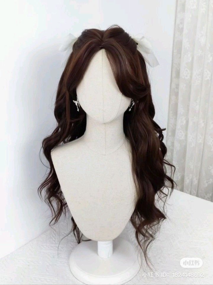 Tạo kiểu cho tóc dài với nơ và xoăn sóng